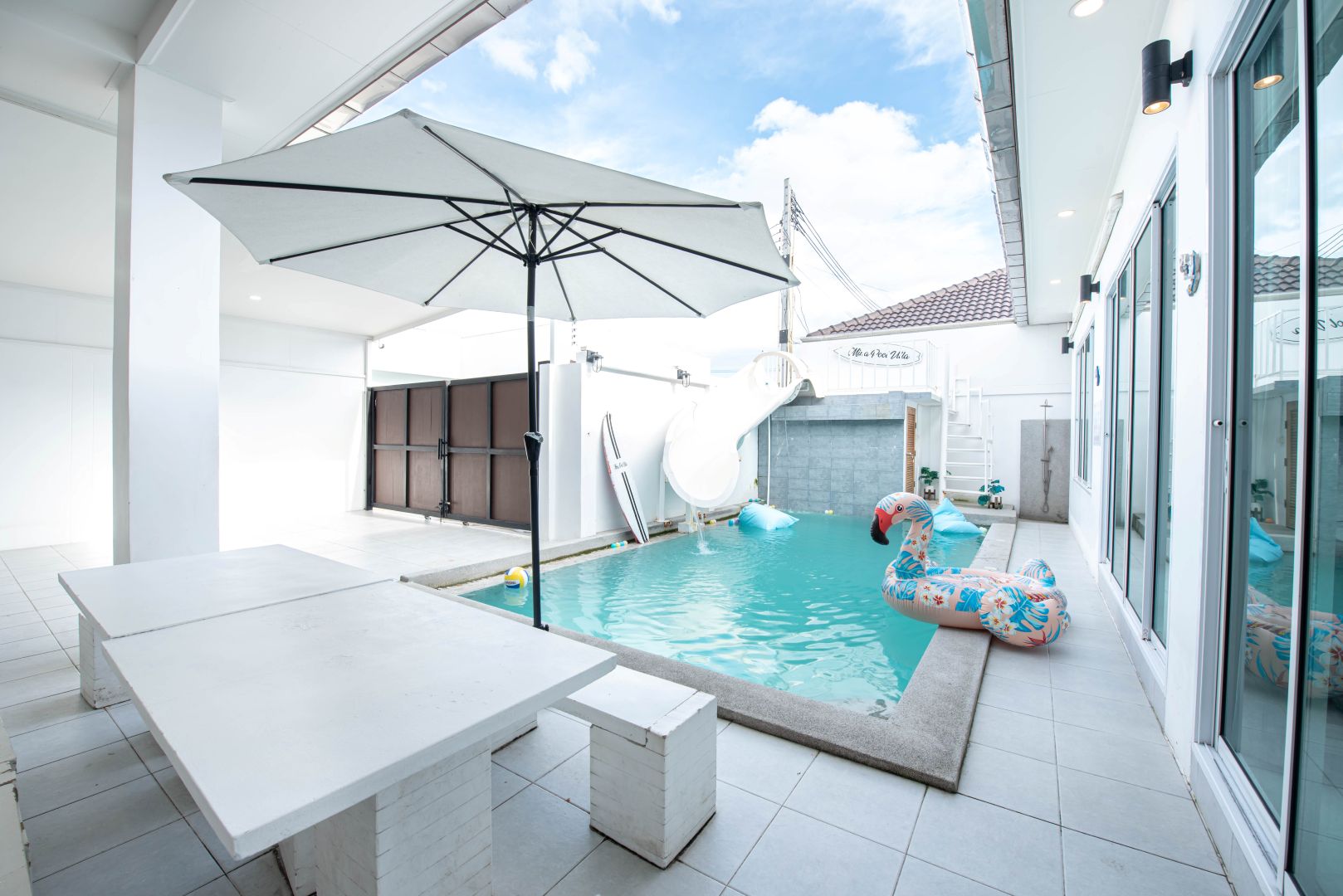 Private pool with waterslide at Mina Pool Villa