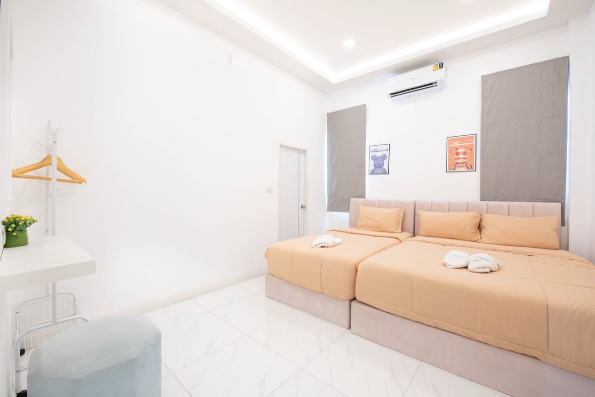 Cream bedroom with twin beds