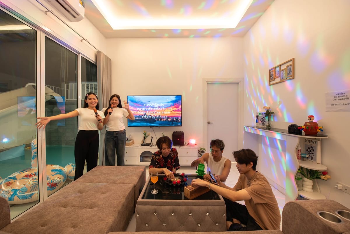 Living room set up for karaoke at night with colour lighting